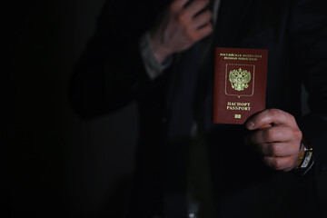 Traveling businessman handing russian passport