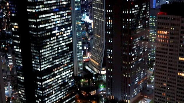Skyscrapers and traffic in Shinjuku, Tokyo, Japan at night