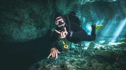 cool scuba diver in cenote