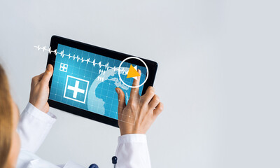 Close of female doctor hands working with tablet pc computer