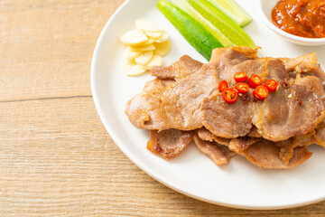 grilled pork neck sliced on plate