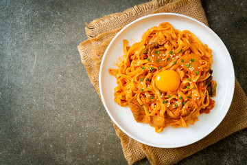 stir-fried udon noodles with kimchi and pork