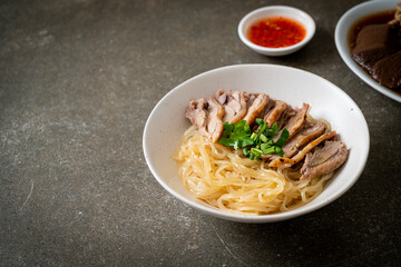 dried duck noodles in white bowl