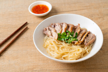 dried duck noodles in white bowl