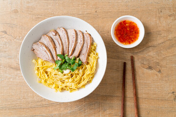 dried duck noodles in white bowl