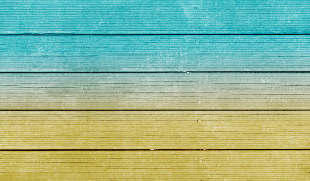 Painted wood deck floor texture background reminiscent of golden sand of seashore and mint emerald sea. There is blank empty space for copyspace and can be used for composing