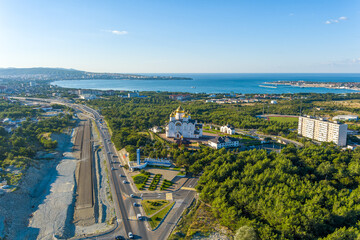 Gelendzhik, Russia. Cathedral of St. Andrew the First-Called. Text on steel to EN: Gelendzhik. Resort city. Along the highway to EN: Glory to Russia. Summer morning. Aerial view
