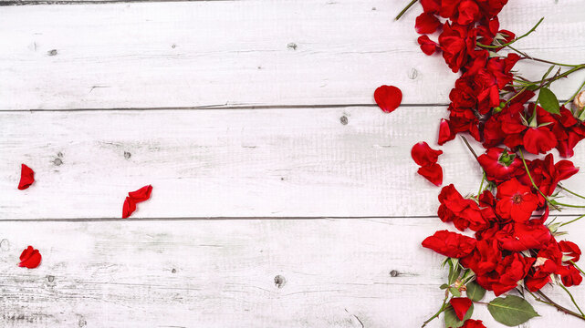 Happy Mothers Day fresh red roses on white wood table and background. Copy space