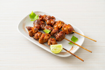 grilled chicken gizzard skewer with herbs and spices