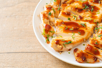 grilled chicken breast sliced on plate