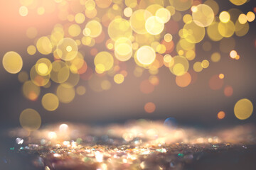 Defocused iridescent glitter texture with light sunny bokeh. Colorful holiday background