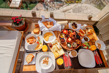 Turkish breakfast. Omelette. Cheeses. Snacks. Nuts. Hearty breakfast. Bread. Coffee. A lot of tasty food. Natural juice. Cottage cheese, yogurt