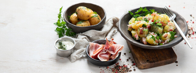 Kartoffelsalat - traditional German potato salad. Potato salad with bacon.