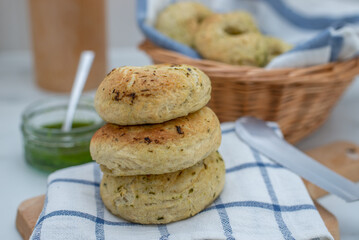 home made whole grain Bagels with wild garlic on a table