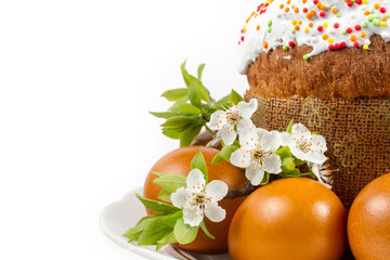 Obraz na płótnie Canvas Easter cake and eggs on a white background. Easter composition with spring flowers on a white background.