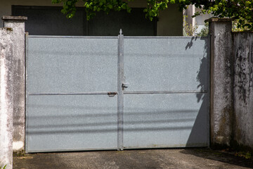 brut raw grey panel vintage steel metal gate house portal door of suburb access home