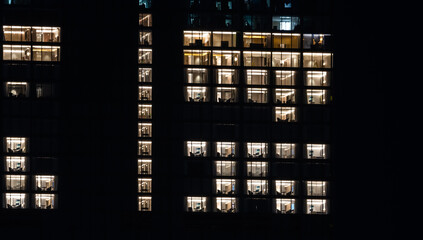 Illuminated windows at night in downtown SIngapore