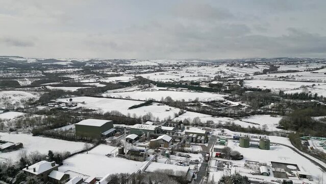 Urban Winter Scene. Aerial Drone Video Footage showing a snowy landscape in a suburban UK town.