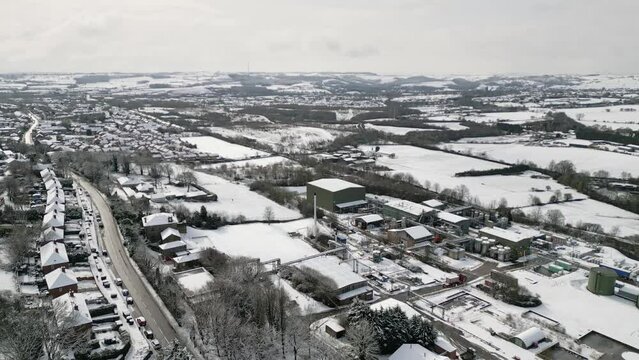 Urban Winter Scene. Aerial Drone Video Footage showing a snowy landscape in a suburban UK town.