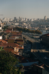 Fototapeta na wymiar View over the old town of Porto, Portugal with the cathedral, colorful buildings and orange roofs