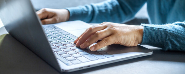 Woman working with modern laptop computer on desktop screen for advertising, mockup, technology, advertising, search information, creative design, learning, webinar, study, watching on table