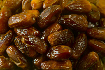 Dates. Dried date palm fruits. Healthy sweet snack food Pile of tasty dry dattes. Date harvest symbolizing Ramadan.