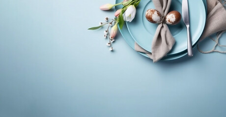 Festive table setting with willow twigs and tulips on a light blue background spring theme
