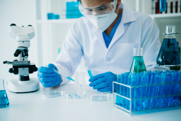 Fototapeta premium Male scientist researcher conducting an experiment working in chemical laboratory