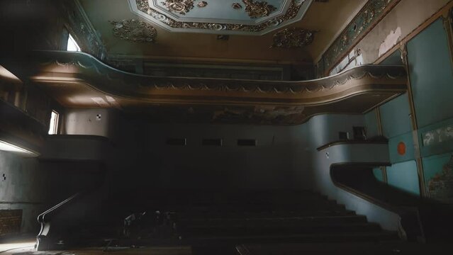 Large creepy dark old vintage hall of abandoned cinema or theatre house inside interior.