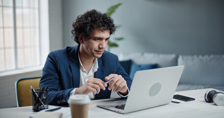 Asian human resources manager having an online interview via teleconference. Businessman talking...