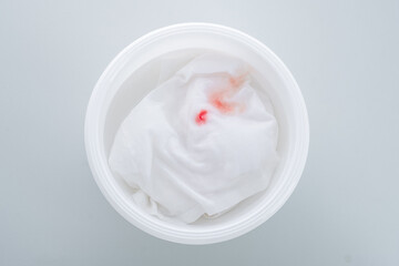 The blood stain on the clothes is soaked in cold water to remove any excess blood. top view. daily life stain concept