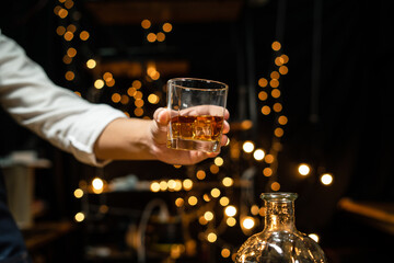 Barman pouring whiskey whiskey glass beautiful night
