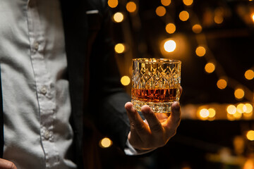 Barman pouring whiskey whiskey glass beautiful night