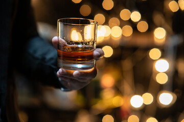 Barman pouring whiskey whiskey glass beautiful night
