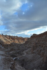 Cathedral Gorge State Park on a cold day in December with fresh snow, located in a long, narrow valley in southeastern Nevada, where erosion has carved patterns in bentonite clay