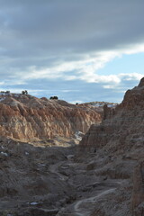 Cathedral Gorge State Park on a cold day in December with fresh snow, located in a long, narrow valley in southeastern Nevada, where erosion has carved patterns in bentonite clay