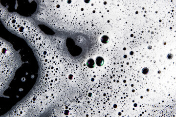 Abstract background white soapy foam texture. Shampoo foam with bubbles - obrazy, fototapety, plakaty
