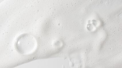 Abstract background white soapy foam texture. Shampoo foam with bubbles
