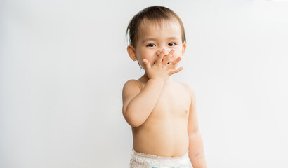 The little son toddler is sending a kiss on white isolated background. Child is so cute. Baby boy...