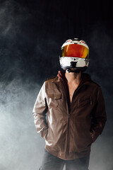 a motorcyclist man in helmet in smoke