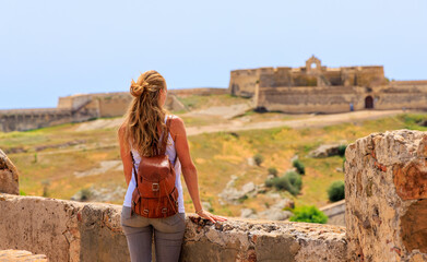 Woman tourist looking portuguese castle- Castro marim in Portugal