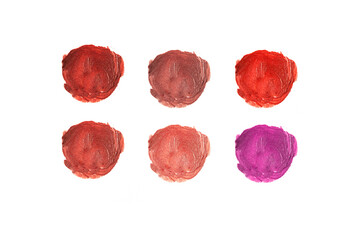 Set of different colors lipstick smear on white isolated, lips make up and cosmetic swatch.