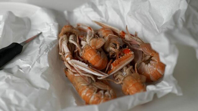 Fresh prawns and oysters from fish market in paper