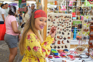 Young woman shopping in a Mexican handicraft market.