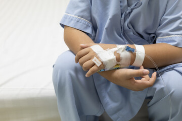 Hand of patient is wrapped in white bandages