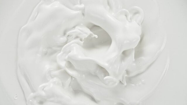Super Slow Motion Shot of Swirling Fresh Milk at 1000fps.