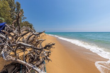 Picture of deserted Natai beach in Thailand during the day with white sand and turquoise blue water