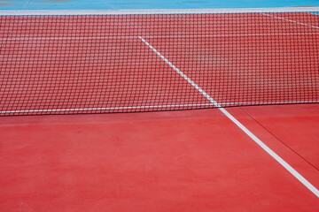 blue and red tennis court netting, racket sports concept