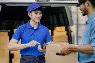 Asian delivery man, Hand using smart phone to scan QR code on tag, concept of parcel delivery, Qr code payment concept.