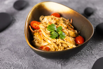 Udon stir-fry noodles with chicken and vegetables. Asian cuisine